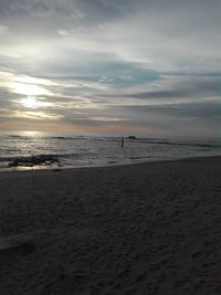 Scenic view of beach against sky during sunset