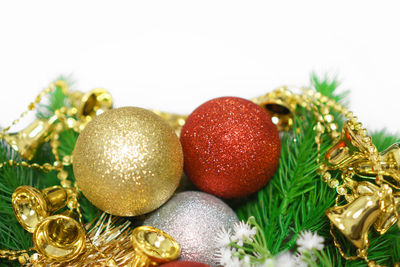 Colorful christmas decorations against white background