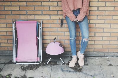 Low section of woman standing on tiled floor