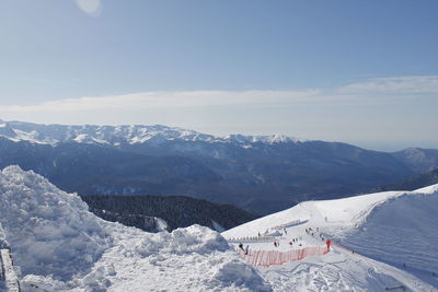 Scenic view of snowcapped mountains against sky