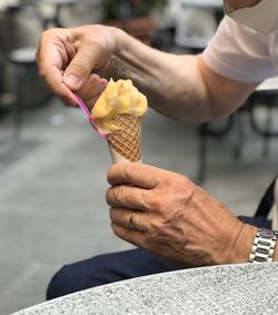 Midsection of woman holding ice cream