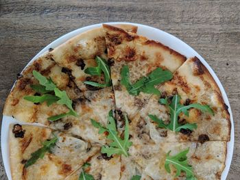 High angle view of pizza in plate on table