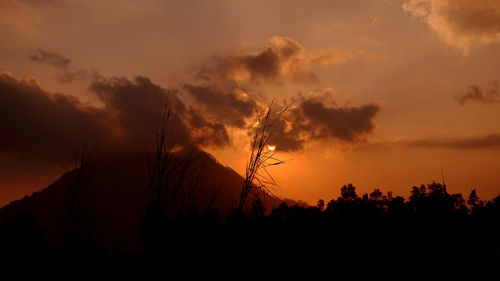 Scenic view of dramatic sky during sunset