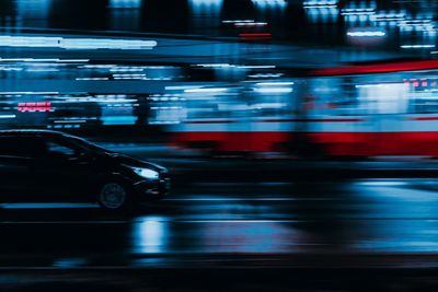 Blurred motion of vehicles on city street at night