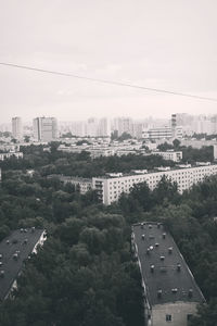 High angle view of buildings in city against sky