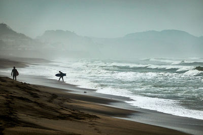 Scenic view of beach against sky