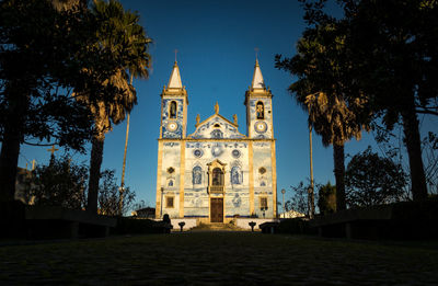 Low angle view of church against clear blue sky