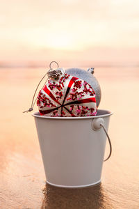 Close-up of dessert on table against sky during sunset