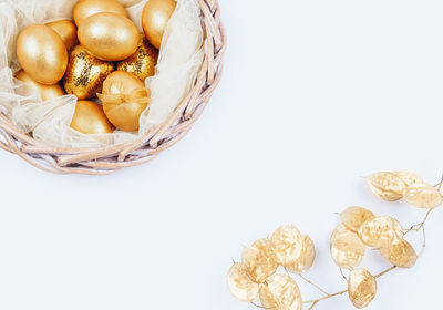 High angle view of berries on white background