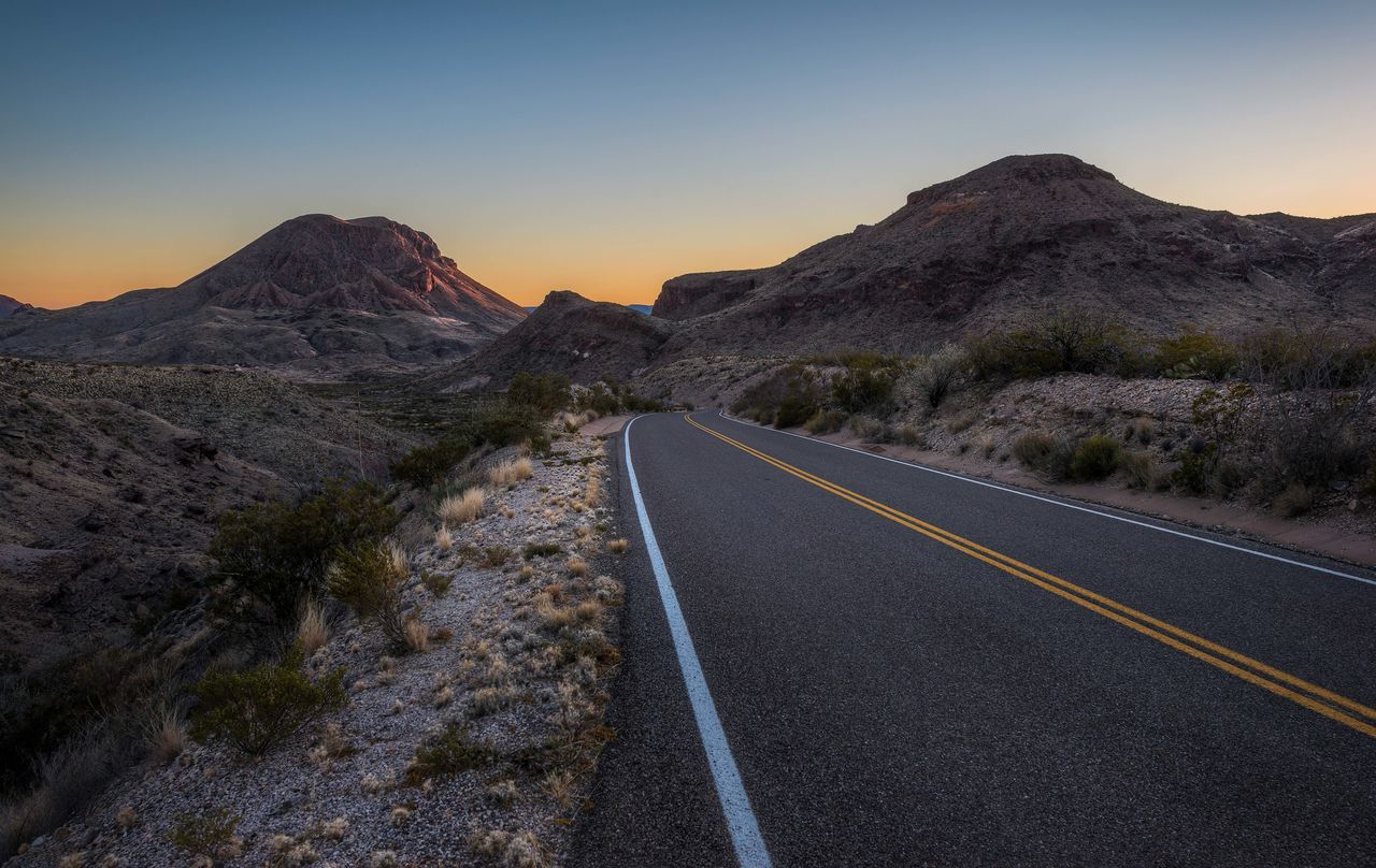 the way forward, transportation, mountain, road, diminishing perspective, road marking, vanishing point, clear sky, country road, tranquil scene, mountain range, landscape, tranquility, empty road, sky, scenics, nature, non-urban scene, asphalt, beauty in nature