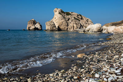 Scenic view of sea against clear blue sky