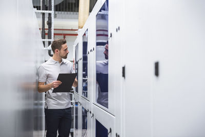 Man examining the system in factory