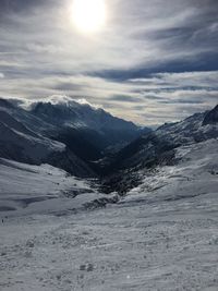 Scenic view of snowcapped mountains against sky