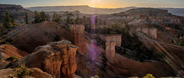 Scenic view of landscape against sky during sunset