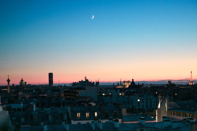 High angle view of buildings against sky at sunset