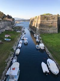 High angle view of sailboats moored on sea against sky at the fort in corfu town