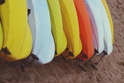 Close-up of multi colored umbrellas hanging on beach