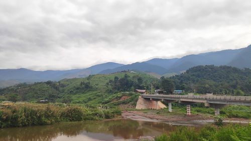 Scenic view of lake and mountains against sky