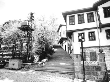 Steps in front of houses against clear sky