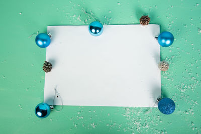 High angle view of blue paper hanging on table