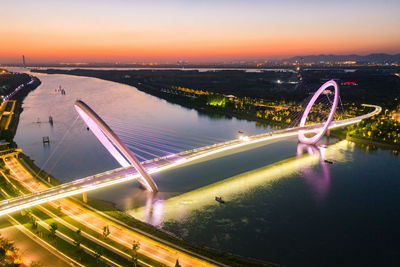 High angle view of light trails on bridge over river