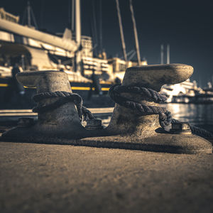 Close-up of rope on bollard against sky