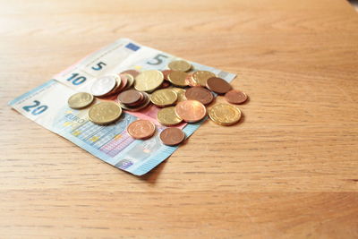 High angle view of coins on table