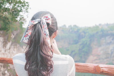 Rear view of woman wearing hat