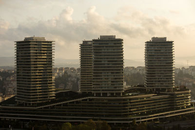 Modern buildings against sky in city