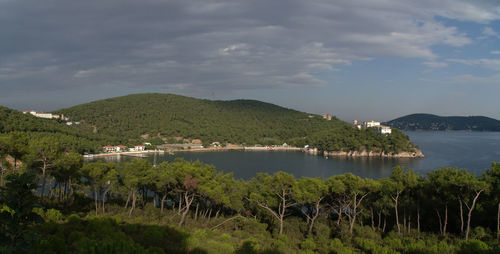 Scenic view of sea and buildings against sky