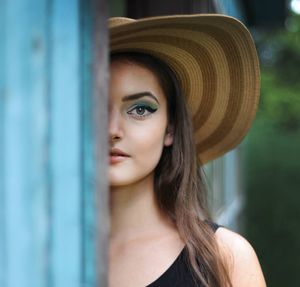 Close-up portrait of young woman with eye make-up