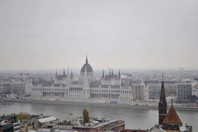 Buildings in city against sky
