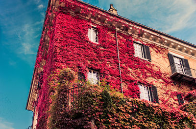 Low angle view of red building against sky