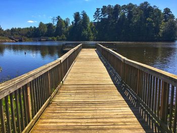 Pier over lake against sky