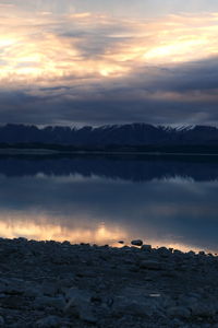 Scenic view of lake against sky during sunset