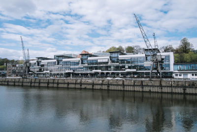 View of buildings against cloudy sky