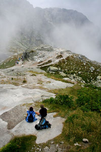 High angle view of people on mountain against sky