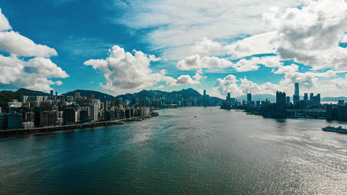 Panoramic view of sea and buildings against sky