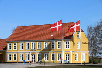 Facade of building against clear sky