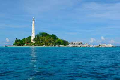 Lighthouse in sea at lengkuas island