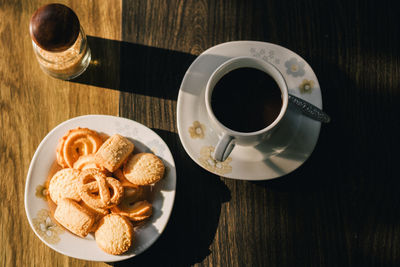 High angle view of coffee served on table