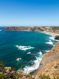 Scenic view of sea against clear blue sky