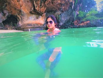 Portrait of woman swimming in pool