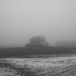 Scenic view of landscape against sky during winter