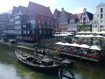 Boats in river with buildings in background