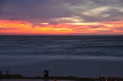 Scenic view of sea against romantic sky at sunset