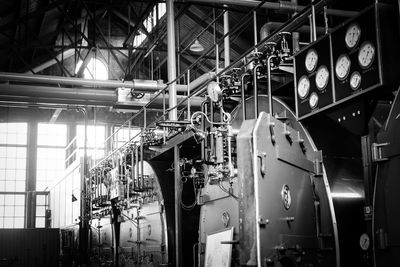 Low angle view of illuminated industry in factory