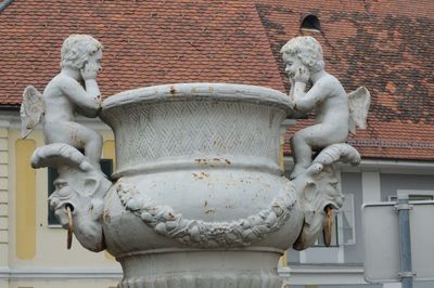 Low angle view of statue against building