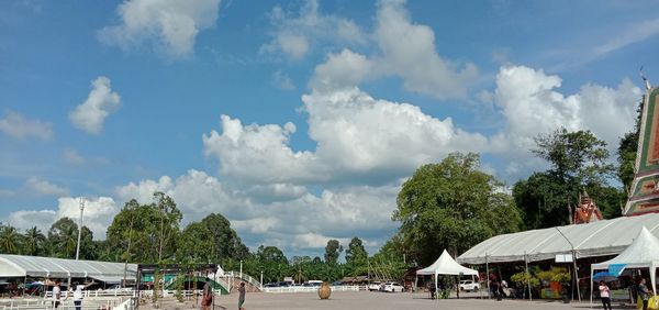 Panoramic view of people against sky