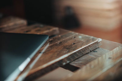 Close-up of digital tablet on wooden table